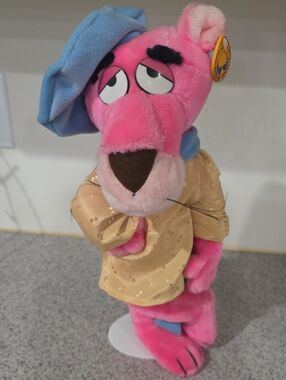 Pink Plush Panther Toy with Blue Hat and Beige Outfit -